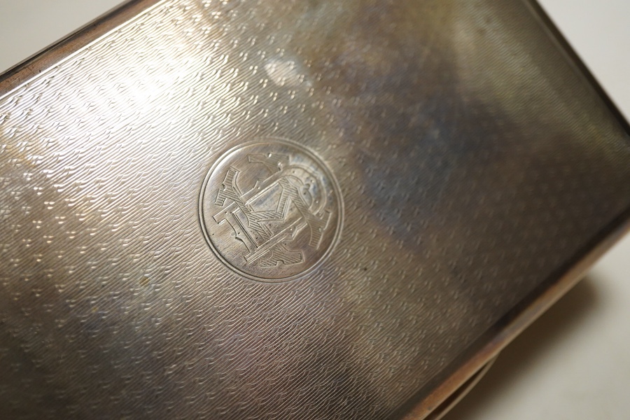 A George V silver table cigarette box with engine turned lid, London, 1924, makers mark rubbed, cedar lined with division, initialled length 14cm.